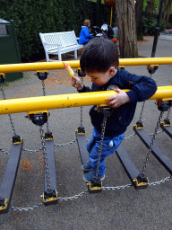 Max on a bridge at the Kleuterhof playground at the Reizenrijk kingdom