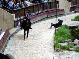 Actors and horse on the stage of the Raveleijn theatre at the Marerijk kingdom, during the Raveleijn Parkshow