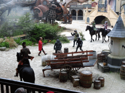 Actors, horses and dragon on the stage of the Raveleijn theatre at the Marerijk kingdom, during the Raveleijn Parkshow