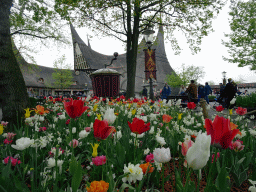 Flowers and the back side of the House of the Five Senses, the entrance to the Efteling theme park, at the Dwarrelplein square