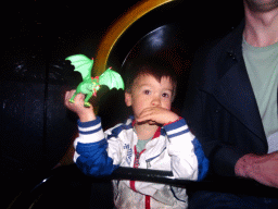 Max with a dragon toy at the Carnaval Festival attraction at the Reizenrijk kingdom