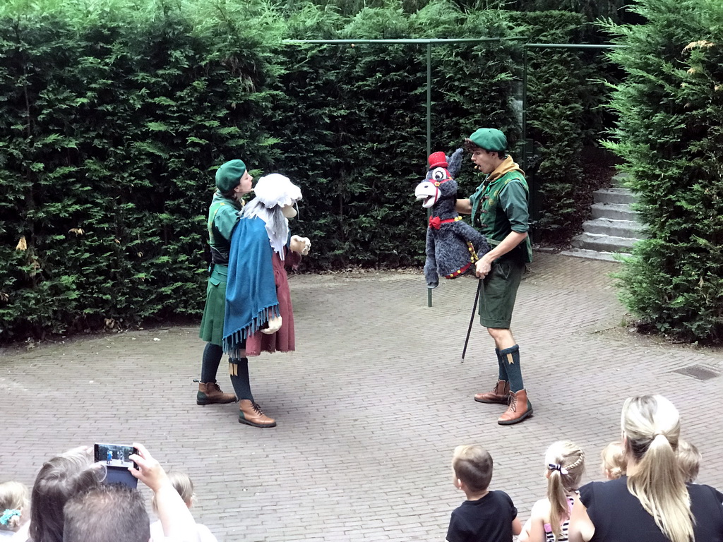 Actors with hand puppets during the Sprookjesboom Show at the Open-air Theatre at the Fairytale Forest at the Marerijk kingdom