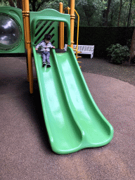 Max on the slide at the Kleuterhof playground at the Reizenrijk kingdom