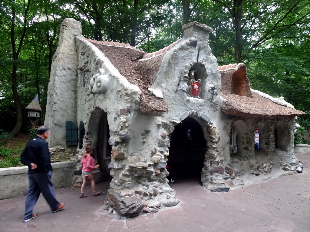 Miaomiao`s father in front of the Wolf and the Seven Kids attraction at the Fairytale Forest at the Marerijk kingdom