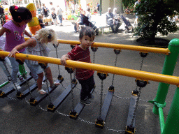 Max on the bridge at the Kleuterhof playground at the Reizenrijk kingdom