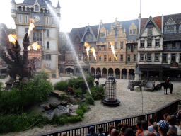 Actors, horse and dragon spitting fire on the stage of the Raveleijn theatre at the Marerijk kingdom, during the Raveleijn Parkshow