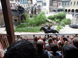 Actors, horses and dragon on the stage of the Raveleijn theatre at the Marerijk kingdom, during the Raveleijn Parkshow