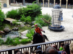 Actors and horse on the stage of the Raveleijn theatre at the Marerijk kingdom, during the Raveleijn Parkshow