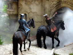 Actors and horses on the stage of the Raveleijn theatre at the Marerijk kingdom, during the Raveleijn Parkshow