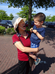 Max and his grandmother at the parking lot