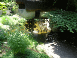 Water wheel at the Lal`s Brouwhuys building at the Laafland attraction at the Marerijk kingdom, viewed from the monorail