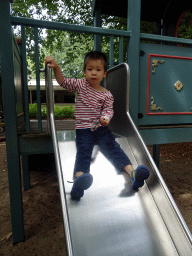 Max on the slide at the Kindervreugd playground at the Marerijk kingdom