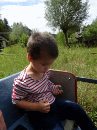 Max in the train at the Kinderspoor attraction at the Ruigrijk kingdom