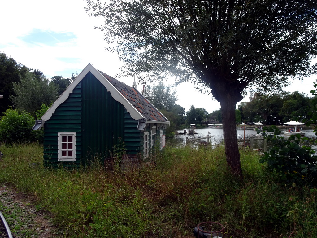 House at the Kinderspoor attraction at the Ruigrijk kingdom and the Gondoletta lake at the Reizenrijk kingdom, viewed from the train