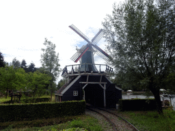 Windmill at the Kinderspoor attraction at the Ruigrijk kingdom, viewed from the train