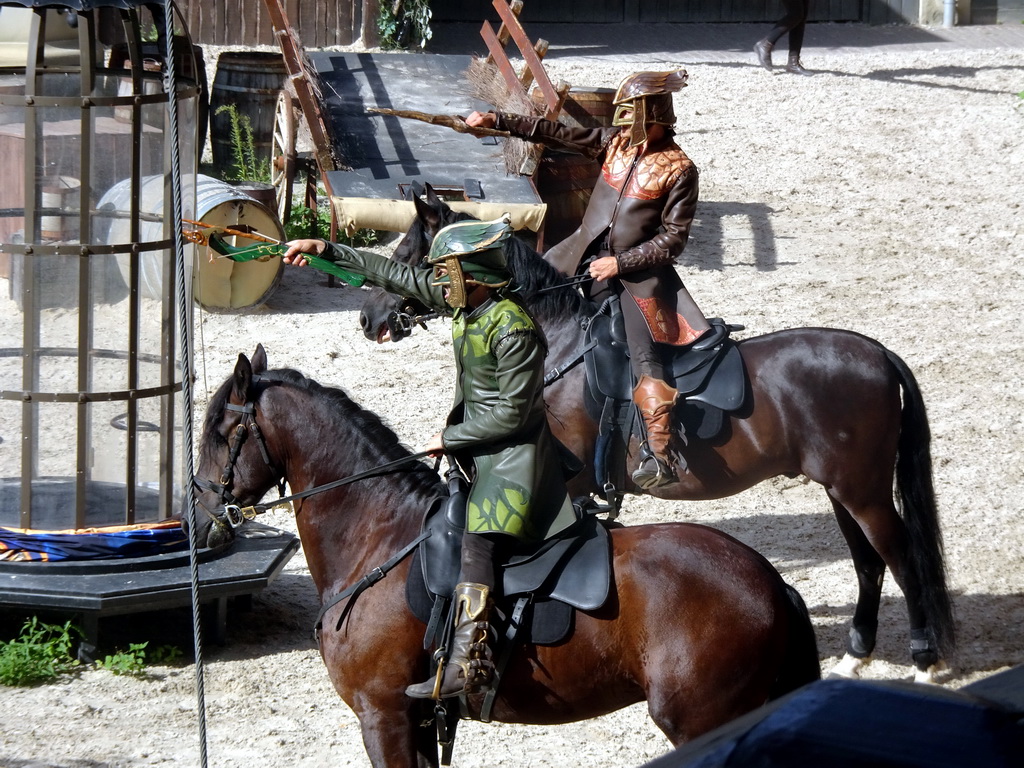 Actors and horses on the stage of the Raveleijn theatre at the Marerijk kingdom, during the Raveleijn Parkshow