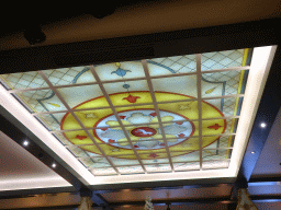 Stained glass window at the ceiling of the Witte Paard restaurant at the Anton Pieck Plein square at the Marerijk kingdom