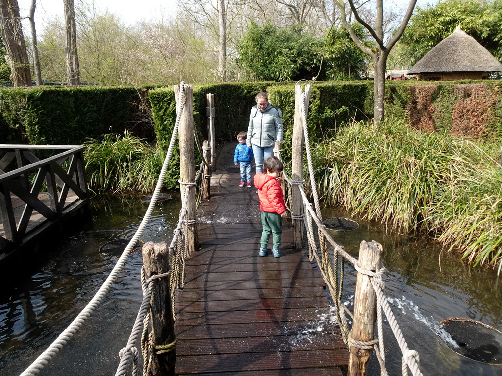 Max on a bridge with fountains at the Adventure Maze at the Reizenrijk kingdom