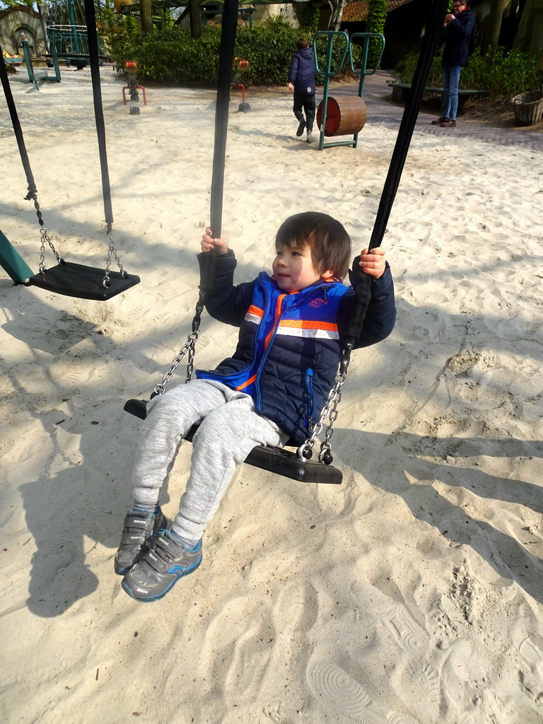 Max on a swing at the Kindervreugd playground at the Marerijk kingdom