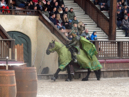 Actor and horse on the stage of the Raveleijn theatre at the Marerijk kingdom, during the Raveleijn Parkshow, viewed from the Wapen van Raveleijn restaurant