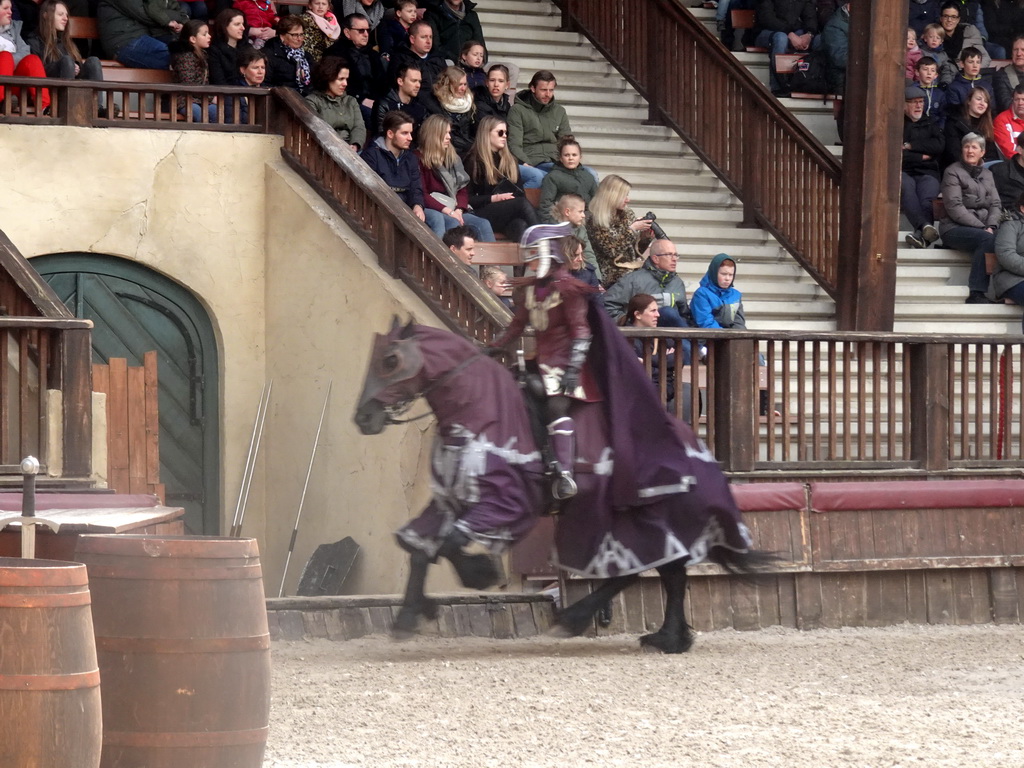 Actor and horse on the stage of the Raveleijn theatre at the Marerijk kingdom, during the Raveleijn Parkshow, viewed from the Wapen van Raveleijn restaurant