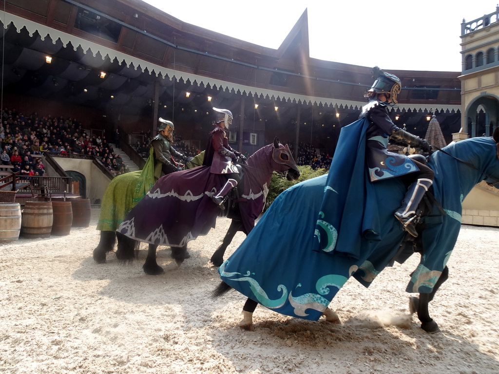 Actors and horses on the stage of the Raveleijn theatre at the Marerijk kingdom, during the Raveleijn Parkshow, viewed from the Wapen van Raveleijn restaurant