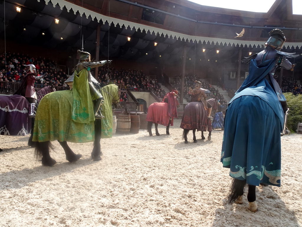 Actors and horses on the stage of the Raveleijn theatre at the Marerijk kingdom, during the Raveleijn Parkshow, viewed from the Wapen van Raveleijn restaurant