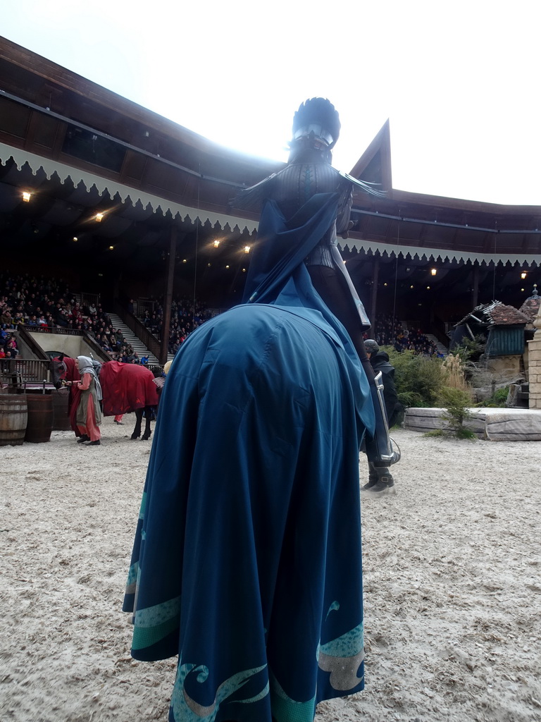 Actors and horses on the stage of the Raveleijn theatre at the Marerijk kingdom, during the Raveleijn Parkshow, viewed from the Wapen van Raveleijn restaurant