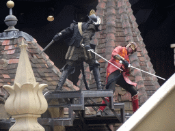 Actors on the stage of the Raveleijn theatre at the Marerijk kingdom, during the Raveleijn Parkshow, viewed from the Wapen van Raveleijn restaurant