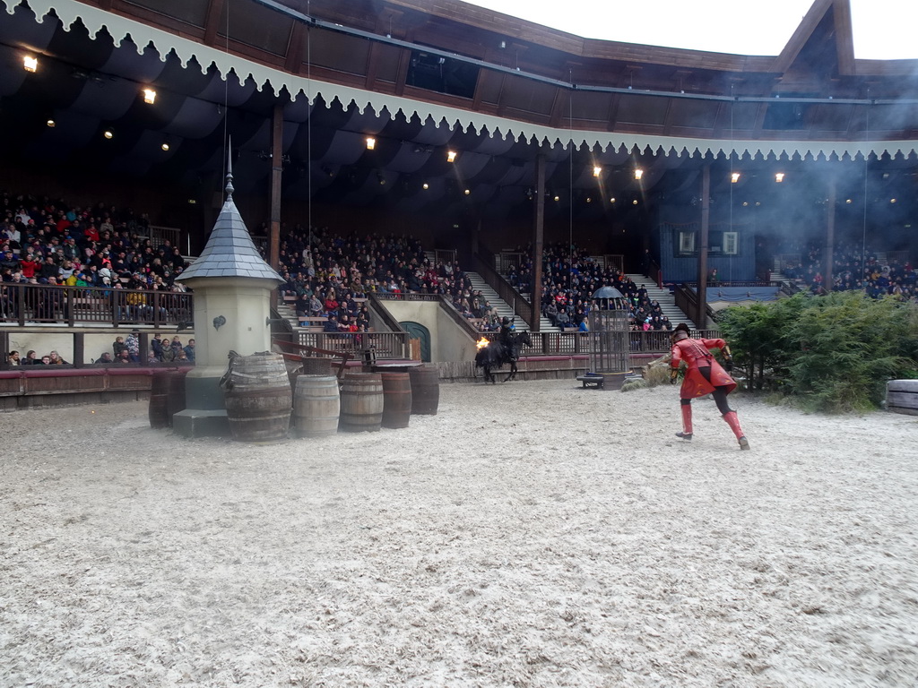 Actor and horse on the stage of the Raveleijn theatre at the Marerijk kingdom, during the Raveleijn Parkshow, viewed from the Wapen van Raveleijn restaurant