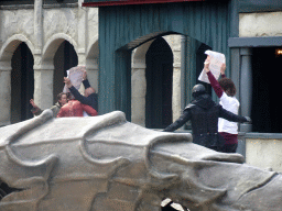 Actors and Vegan Strike Group protesters on the stage of the Raveleijn theatre at the Marerijk kingdom, during the Raveleijn Parkshow, viewed from the Wapen van Raveleijn restaurant