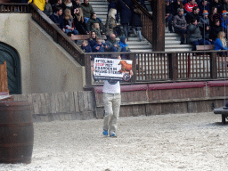 Vegan Strike Group protester on the stage of the Raveleijn theatre at the Marerijk kingdom, during the Raveleijn Parkshow, viewed from the Wapen van Raveleijn restaurant