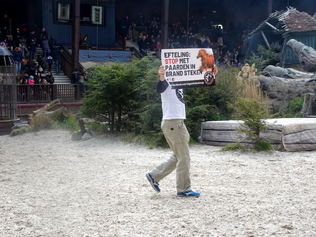 Vegan Strike Group protester on the stage of the Raveleijn theatre at the Marerijk kingdom, during the Raveleijn Parkshow, viewed from the Wapen van Raveleijn restaurant