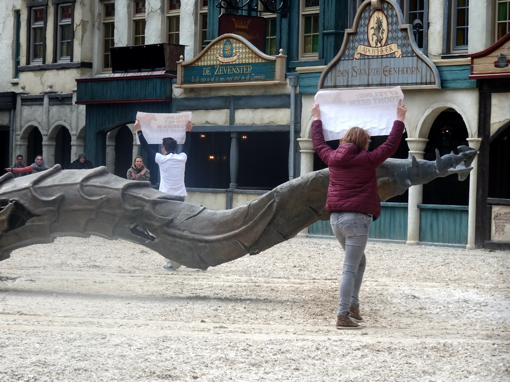 Dragon, actors and Vegan Strike Group protesters on the stage of the Raveleijn theatre at the Marerijk kingdom, during the Raveleijn Parkshow, viewed from the Wapen van Raveleijn restaurant