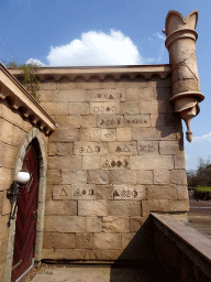 Wall with symbols at the waiting line for the Symbolica attraction at the Fantasierijk kingdom