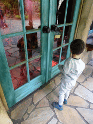 Max in front of Geppetto`s House at the Pinocchio attraction at the Fairytale Forest at the Marerijk kingdom