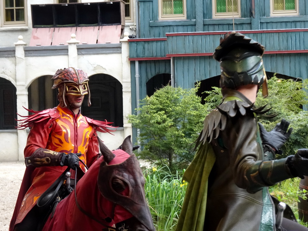 Actors and horses on the stage of the Raveleijn theatre at the Marerijk kingdom, during the Raveleijn Parkshow