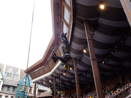 Actors coming down from the ceiling of the grandstand to the stage of the Raveleijn theatre at the Marerijk kingdom, during the Raveleijn Parkshow