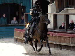 Actor and horse on fire on the stage of the Raveleijn theatre at the Marerijk kingdom, during the Raveleijn Parkshow