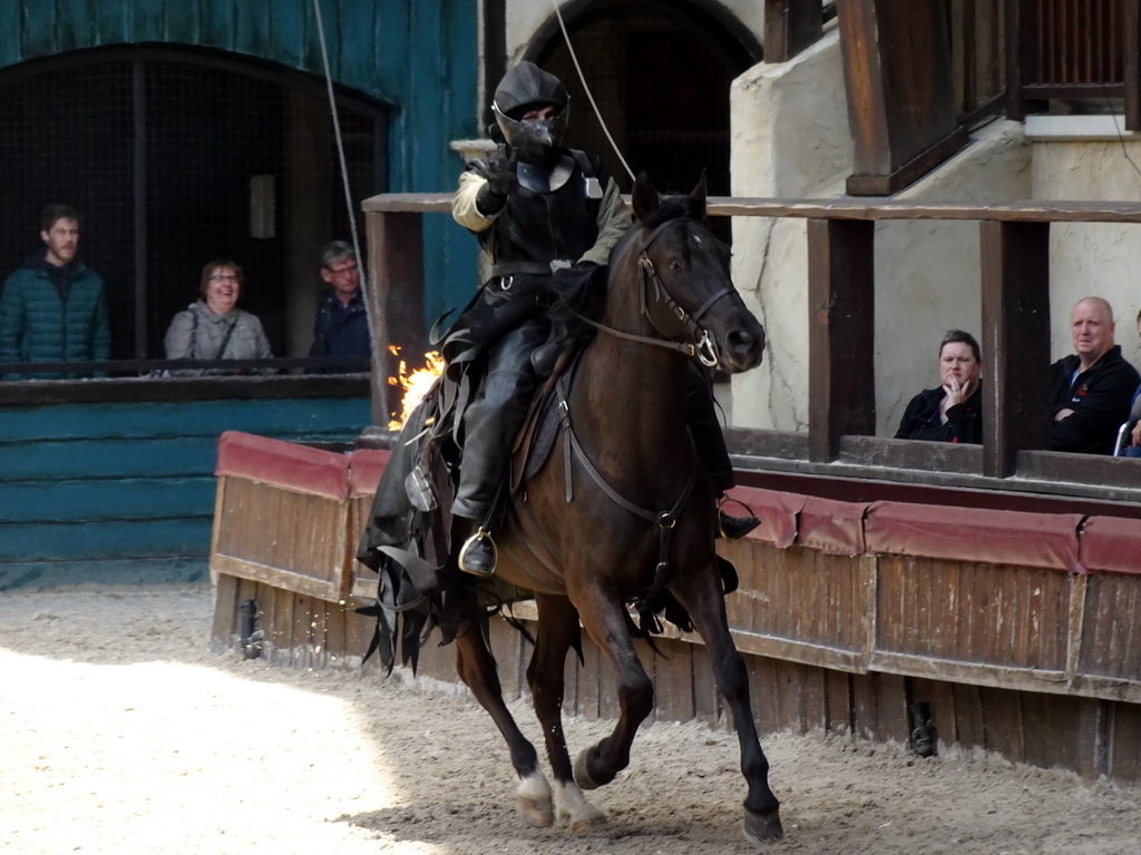 Actor and horse on fire on the stage of the Raveleijn theatre at the Marerijk kingdom, during the Raveleijn Parkshow