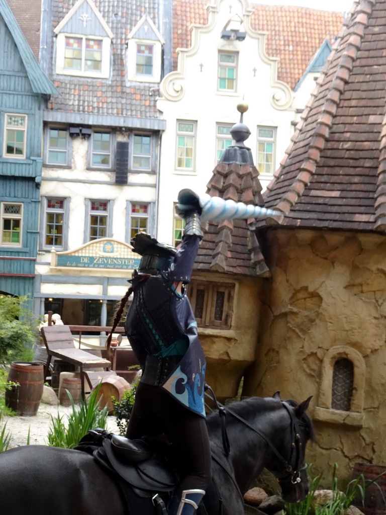 Actor and horse on the stage of the Raveleijn theatre at the Marerijk kingdom, during the Raveleijn Parkshow