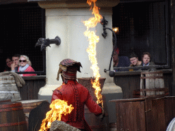 Actor and fire on the stage of the Raveleijn theatre at the Marerijk kingdom, during the Raveleijn Parkshow