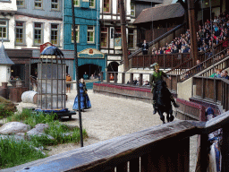 Actors and horse on the stage of the Raveleijn theatre at the Marerijk kingdom, during the Raveleijn Parkshow