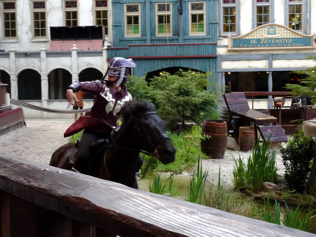 Actor and horse on the stage of the Raveleijn theatre at the Marerijk kingdom, during the Raveleijn Parkshow