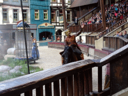 Actors and horse on the stage of the Raveleijn theatre at the Marerijk kingdom, during the Raveleijn Parkshow