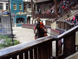 Actors and horse on the stage of the Raveleijn theatre at the Marerijk kingdom, during the Raveleijn Parkshow