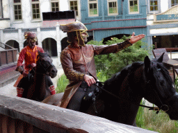 Actors and horses on the stage of the Raveleijn theatre at the Marerijk kingdom, during the Raveleijn Parkshow