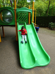 Max with an ice cream on a slide at the Kleuterhof playground at the Reizenrijk kingdom