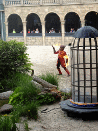 Actor on fire on the stage of the Raveleijn theatre at the Marerijk kingdom, during the Raveleijn Parkshow