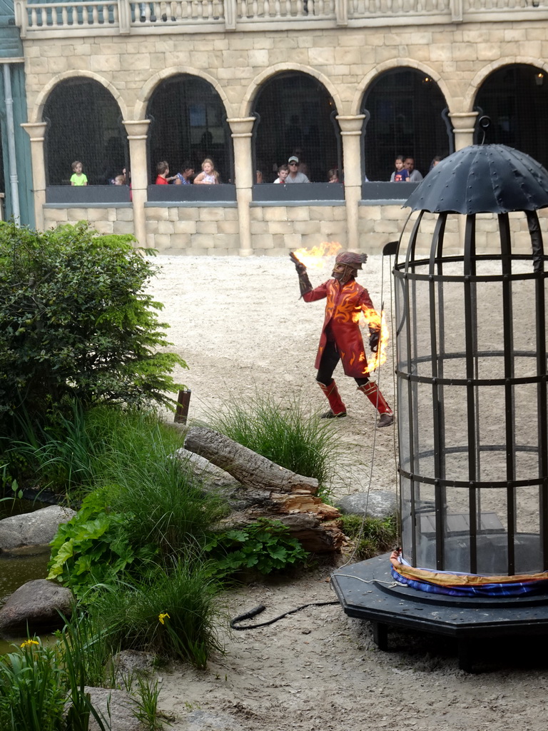 Actor on fire on the stage of the Raveleijn theatre at the Marerijk kingdom, during the Raveleijn Parkshow